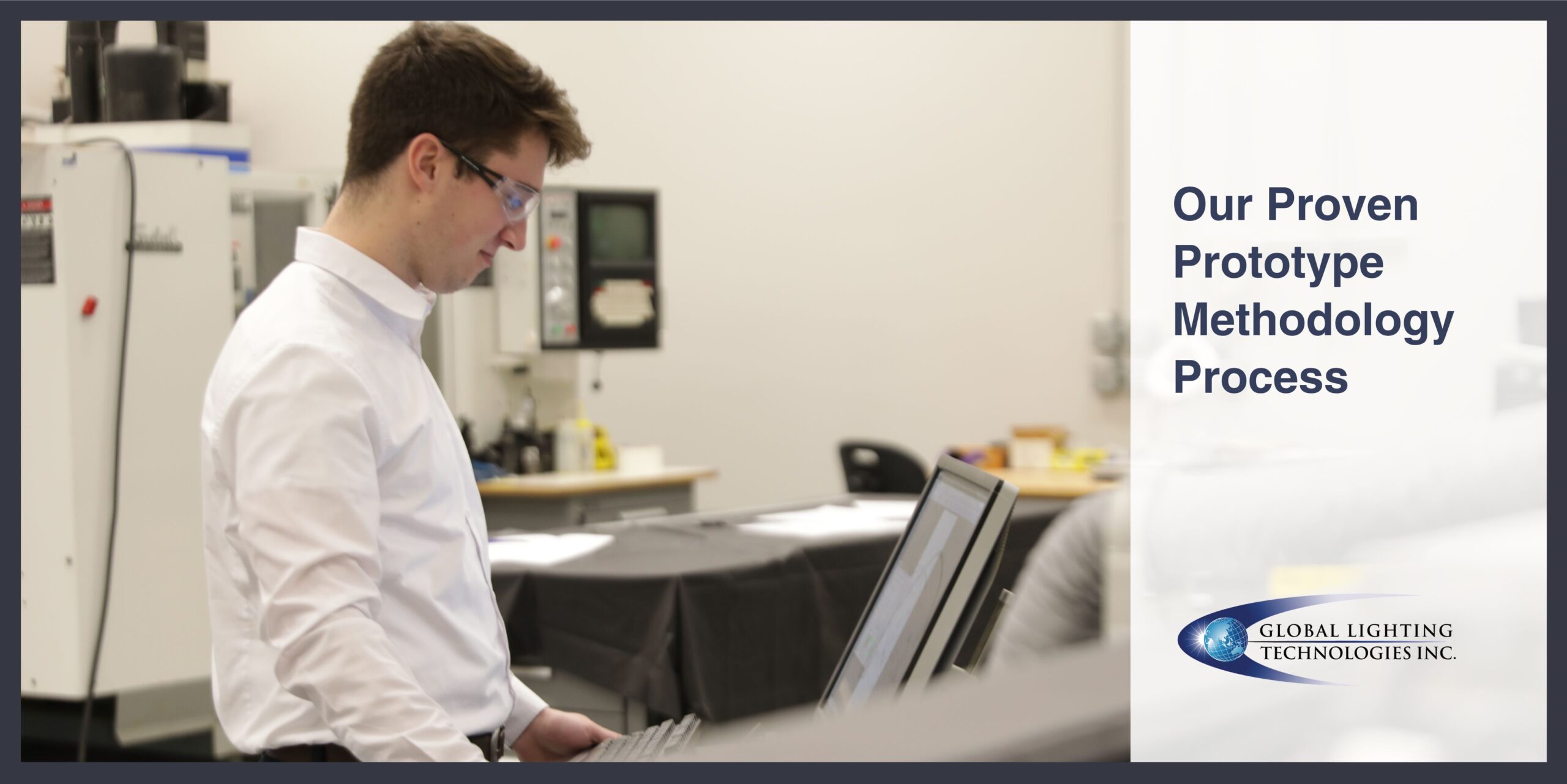 Engineer looks down at a computer during the prototype process.